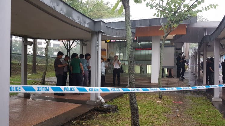 Station staff and Public Transport Security Command officers seen outside Woodleigh MRT station on 18 April. (PHOTO: Wan Ting Koh / Yahoo Newsroom)