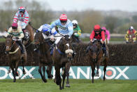 Jockey Stan Sheppard riding Cruz Control leads on their way to win the William Hill Handicap Chase race on the third day of the Grand National Horse Racing meeting at Aintree racecourse, near Liverpool, England, Saturday, April 13, 2024. Organizers of Britain's biggest horse race have taken action to improve safety and avoid a repeat of the chaos sparked by animal-rights activists before last year's edition.(AP Photo/Dave Shopland)