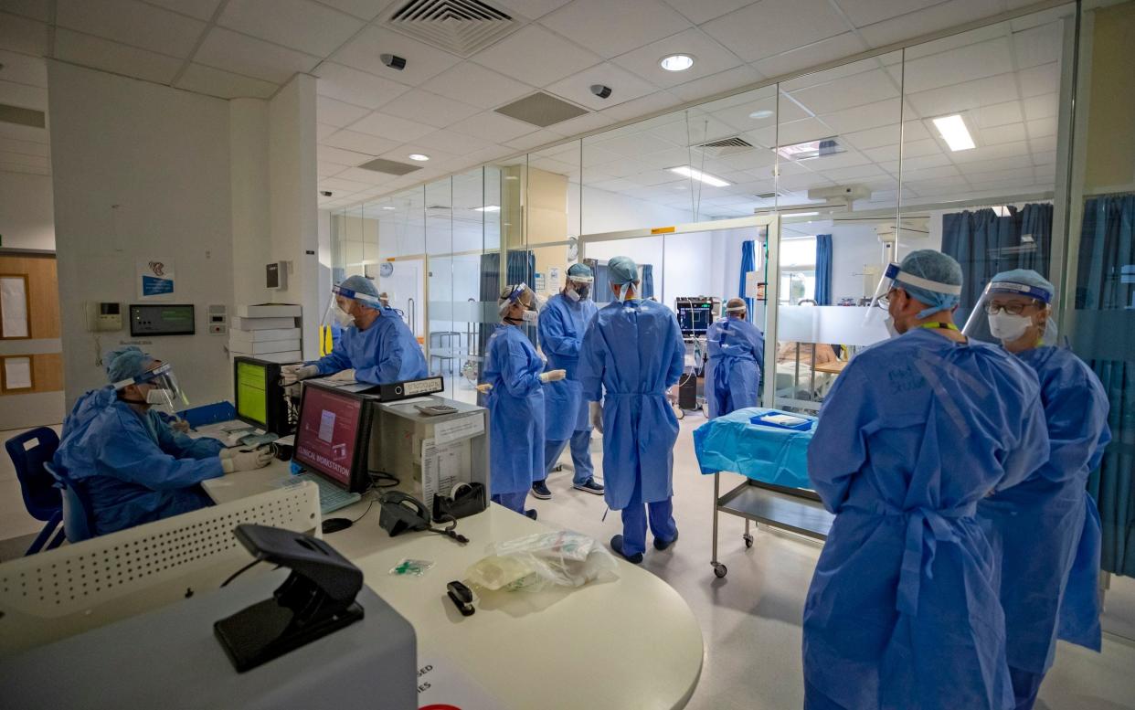 Health workers wearing full personal protective equipment (PPE) on the intensive care unit (ICU) at Whiston Hospital in Merseyside, as it emerges some ICU nurses have been sectioned due to the trauma of the first way - Byrne/PA Wire