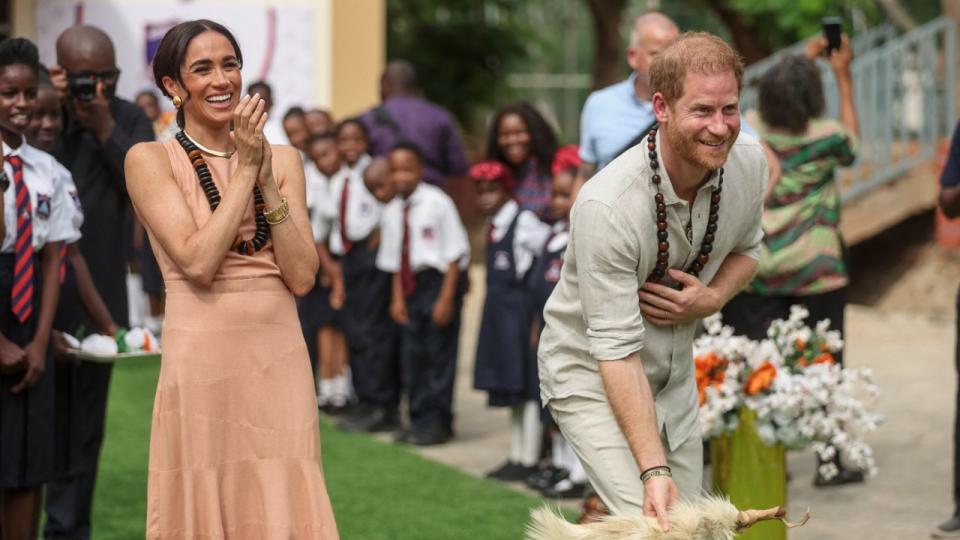 Prince Harry (R), Duke of Sussex, and Meghan (L), Duchess of Sussex. Photo by Kola SULAIMON / AFP) (Photo by KOLA SULAIMON/AFP via Getty Images.