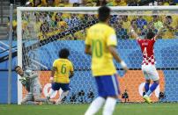 Croatia's Ivan Perisic (R) celebrates as Brazil's Julio Cesar (L) and Marcelo react, after Marcelo scored an own goal during their 2014 World Cup opening match at the Corinthians arena in Sao Paulo June 12, 2014. (REUTERS/Damir Sagolj)