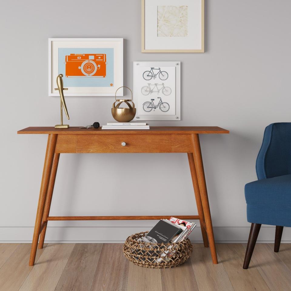 <a href="https://www.target.com/p/amherst-mid-century-modern-desk-console-table-project-62-153/-/A-14963282#lnk=newtab" target="_blank">Shop it here</a>.&nbsp;