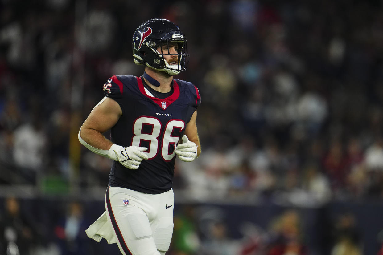 HOUSTON, TX - JANUARY 13: Dalton Schultz #86 of the Houston Texans runs across the field during an NFL wild-card playoff football game against the Cleveland Browns at NRG Stadium on January 13, 2024 in Houston, Texas. (Photo by Cooper Neill/Getty Images)