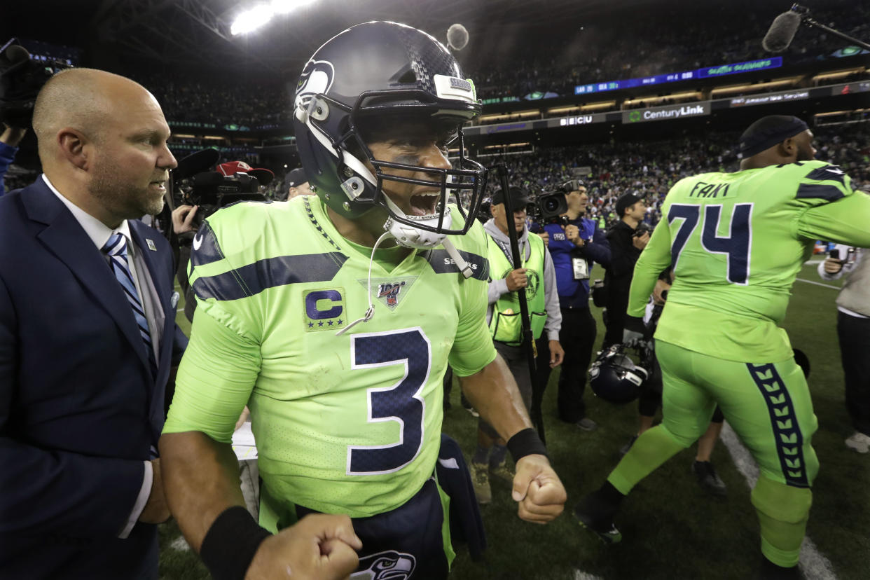 Seattle Seahawks quarterback Russell Wilson reacts after the Seahawks defeated the Los Angeles Rams 30-29 in an NFL football game Thursday, Oct. 3, 2019, in Seattle. (AP Photo/Elaine Thompson)