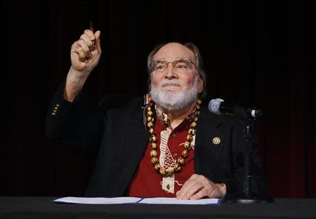 Hawaii Governor Neil Abercrombie holds up the pen after signing Senate Bill 1, allowing same sex marriage to be legal in the state, in Honolulu, Hawaii November 13, 2013. REUTERS/Hugh Gentry