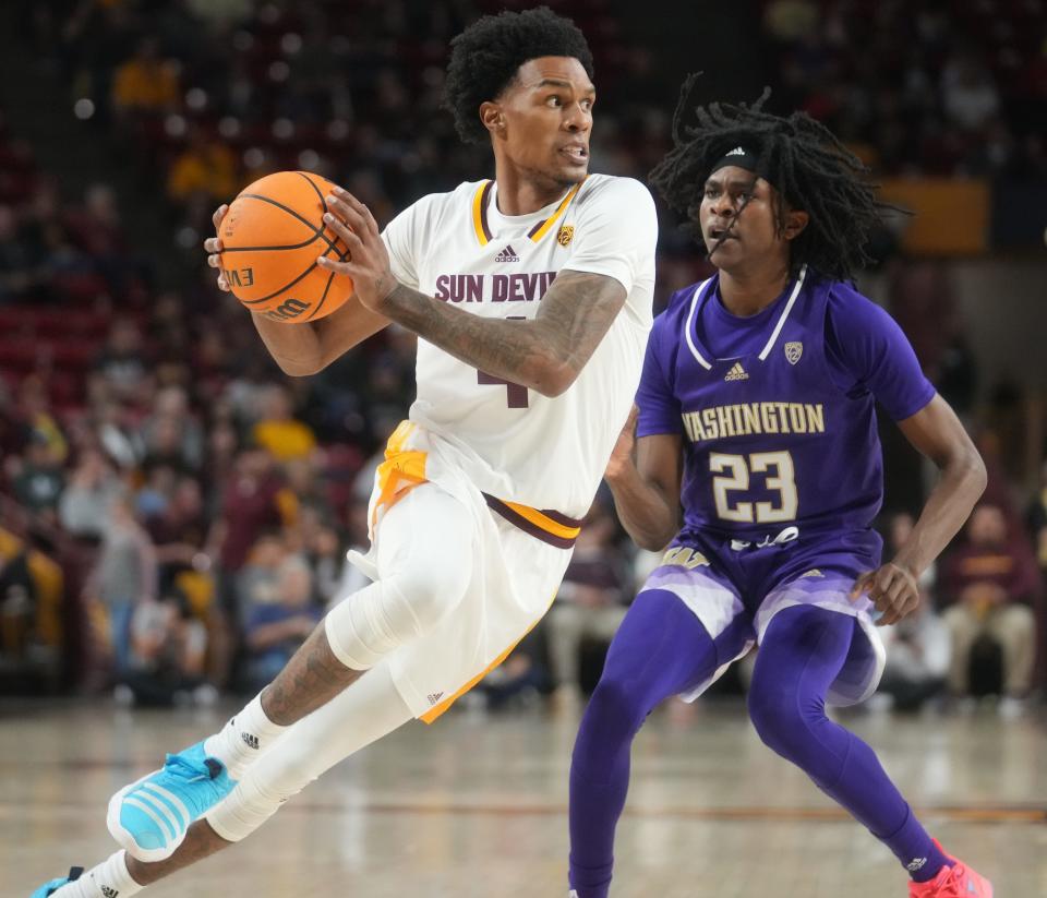 Arizona State guard Desmond Cambridge Jr. (4) drives past Washington's Keyon Menifield (23) in their game Sunday in Tempe. The Sun Devils hit the road this week to face the Oregon schools.