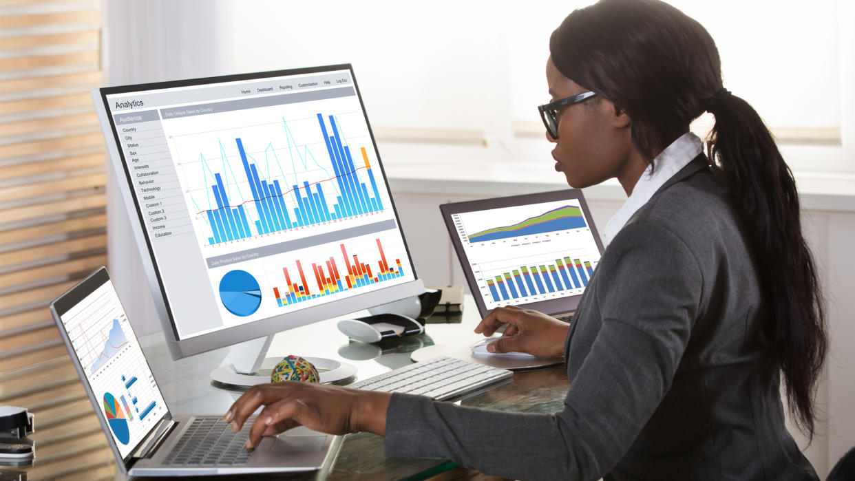 woman looking at charts shutterstock_748165066