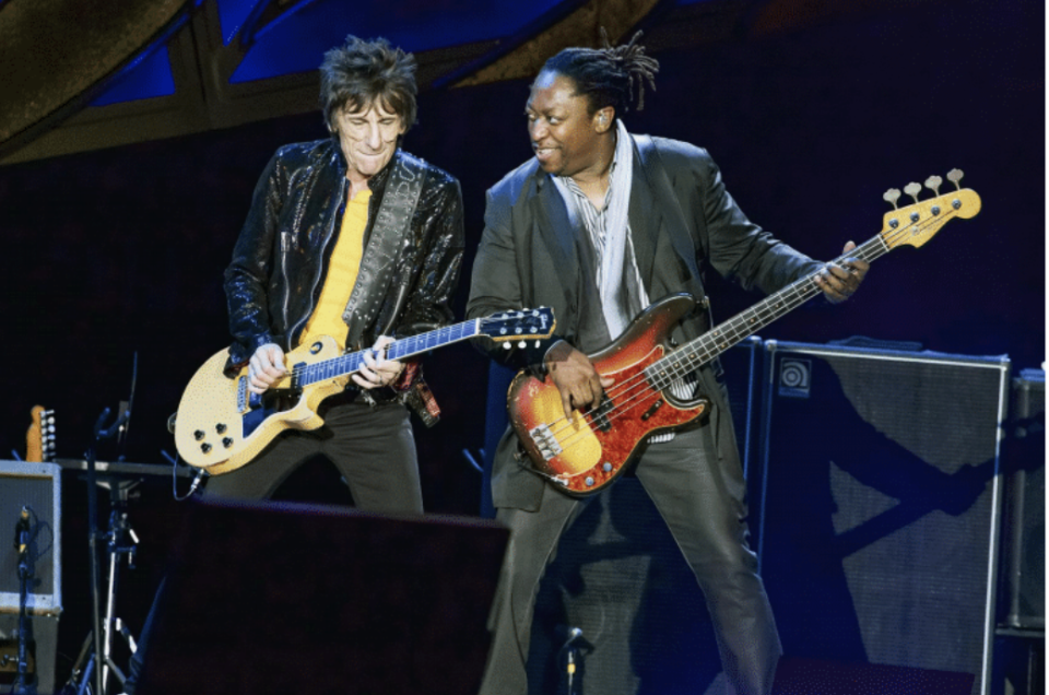 Rolling Stones bassist Darryl Jones (R) plays with guitarist Ronnie Wood