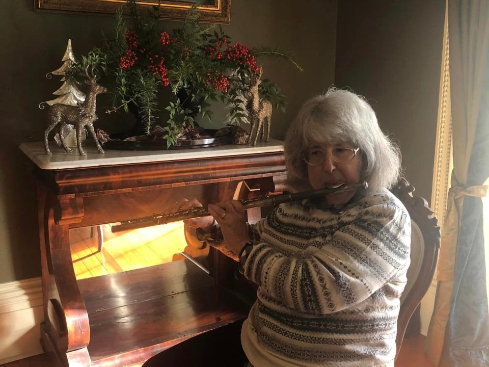 Flutist Iris Schwartz performs during Centre Hill Museum Holiday Showcase open house in Petersburg on December 4.