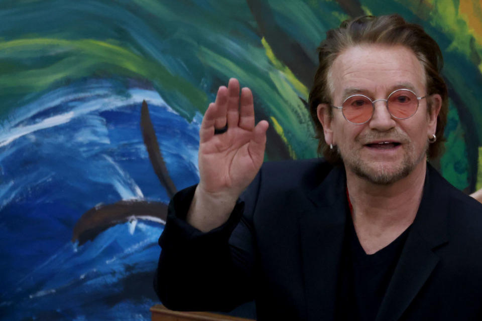 Bono waving