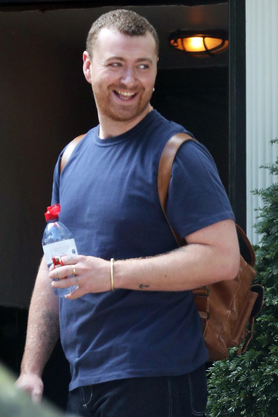 <p>Sam Smith heads to lunch with friends at a local pub on Wednesday in London. </p>