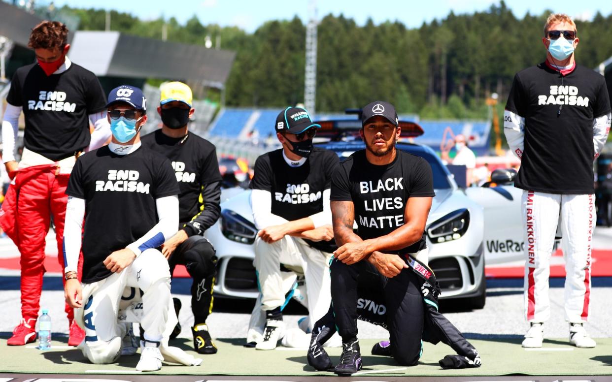 Lewis Hamilton of Great Britain and Mercedes GP, Pierre Gasly of France and Scuderia AlphaTauri and some of the F1 drivers take a knee on the grid in support of the Black Lives Matter movement ahead of the Formula One Grand Prix of Austria at Red Bull Ring on July 05, 2020 - Dan Istitene - Formula 1/Formula 1 via Getty Images
