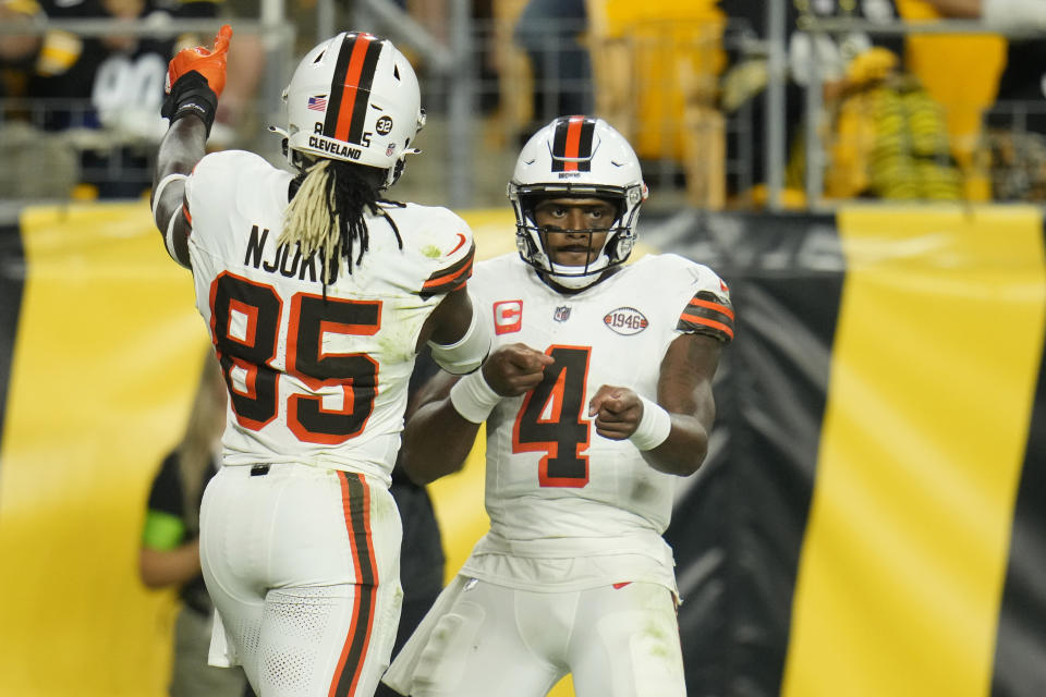 Cleveland Browns quarterback Deshaun Watson (4) celebrates his two-point conversion with tight end David Njoku (85) during the second half of an NFL football game against the Pittsburgh Steelers Monday, Sept. 18, 2023, in Pittsburgh. (AP Photo/Gene J. Puskar)