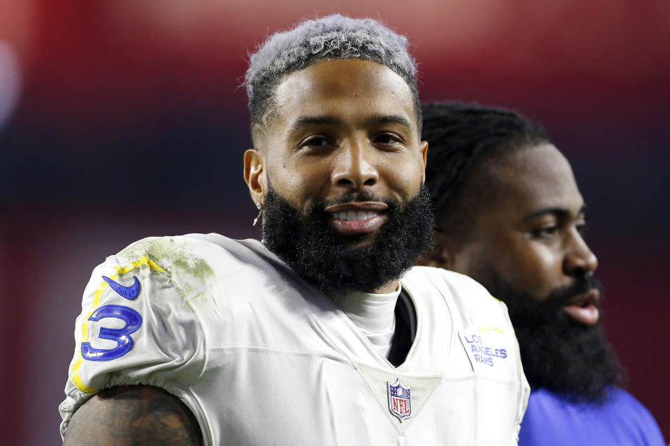 FILE - Los Angeles Rams wide receiver Odell Beckham Jr. walks off the field following an NFL football game against the Arizona Cardinals, Monday, Dec. 13, 2021, in Glendale, Ariz. The bankruptcy of FTX and the arrest of its founder and former CEO are raising new questions about the role celebrity athletes such as Tom Brady, Steph Curry, Naomi Osaka, Beckham Jr., and others played in lending legitimacy to the largely unregulated landscape of crypto, while also reframing the conversation about just how costly blind loyalty to favorite players or teams can be for the average fan. (AP Photo/Ralph Freso, File)