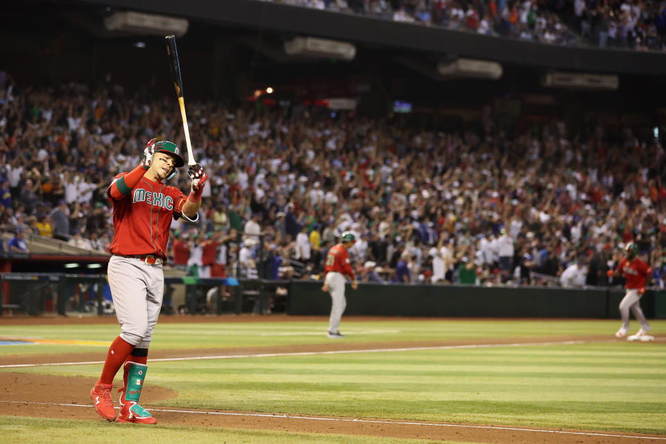 PHOENIX, ARIZONA - MARCH 12: Joey Meneses #32 of Team Mexico flips his bat after hitting a three-run home run against Team USA during the fourth inning of the World Baseball Classic Pool C game at Chase Field on March 12, 2023 in Phoenix, Arizona. (Photo by Christian Petersen/Getty Images)