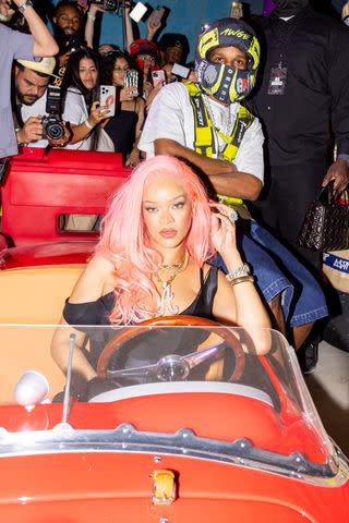 <p>Jojo Korsh/BFA.com/Shutterstock </p> Rihanna and A$AP Rocky pose in a vintage car in Miami on May 4, 2024
