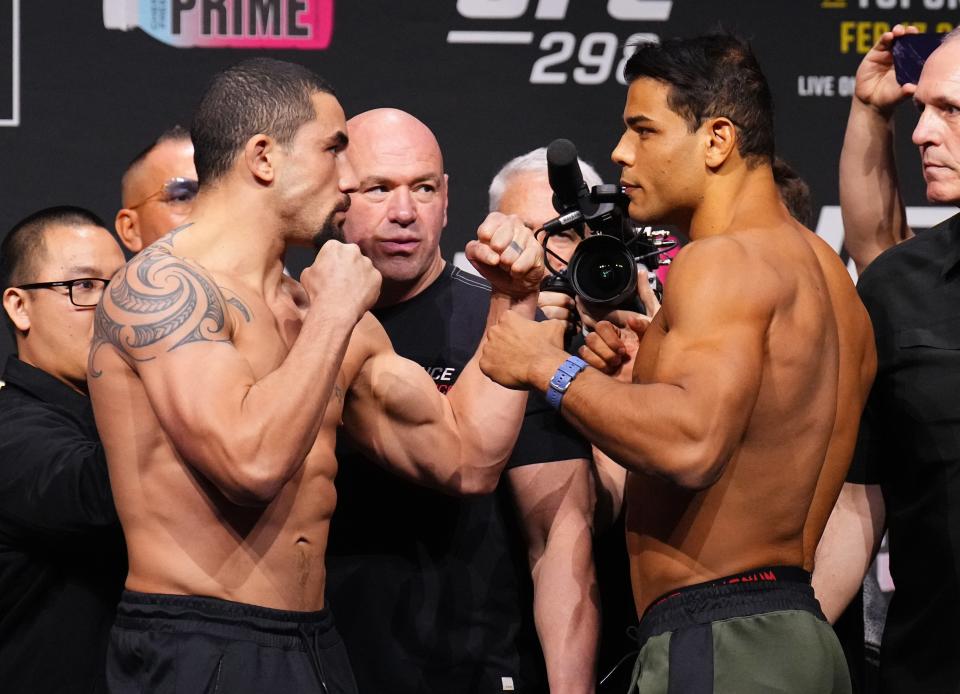 Robert Whittaker (left) facing off with Paulo Costa at the UFC 298 weigh-ins (Zuffa LLC via Getty Images)