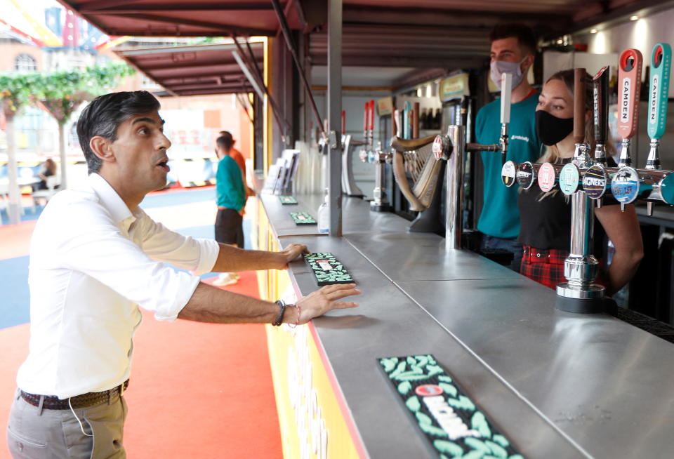 Britain's Chancellor of the Exchequer Rishi Sunak speaks with previously furloughed staff at the London Wonderground comedy and music festival venue in London, on August 5, 2021. (Photo by PETER NICHOLLS / POOL / AFP) (Photo by PETER NICHOLLS/POOL/AFP via Getty Images)