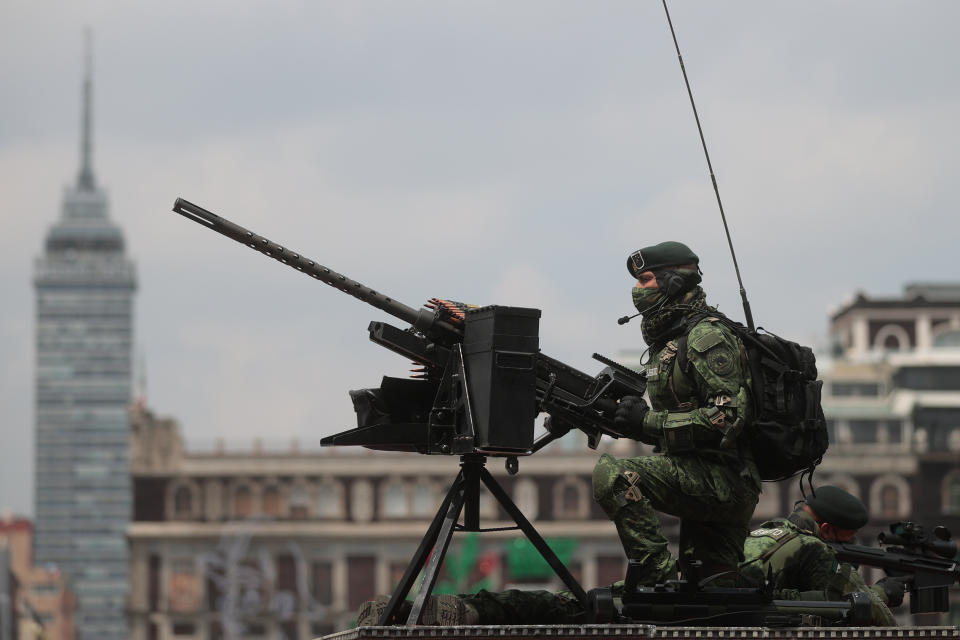 VARIOUS CITIES, MEXICO - SEPTEMBER 16: Soldiers look up towards President Andrés Manuel López Obrador during the Independence Day military parade at Zocalo Square on September 16, 2020 in Various Cities, Mexico. This year El Zocalo remains closed for general public due to coronavirus restrictions. Every September 16 Mexico celebrates the beginning of the revolution uprising of 1810. (Photo by Hector Vivas/Getty Images)