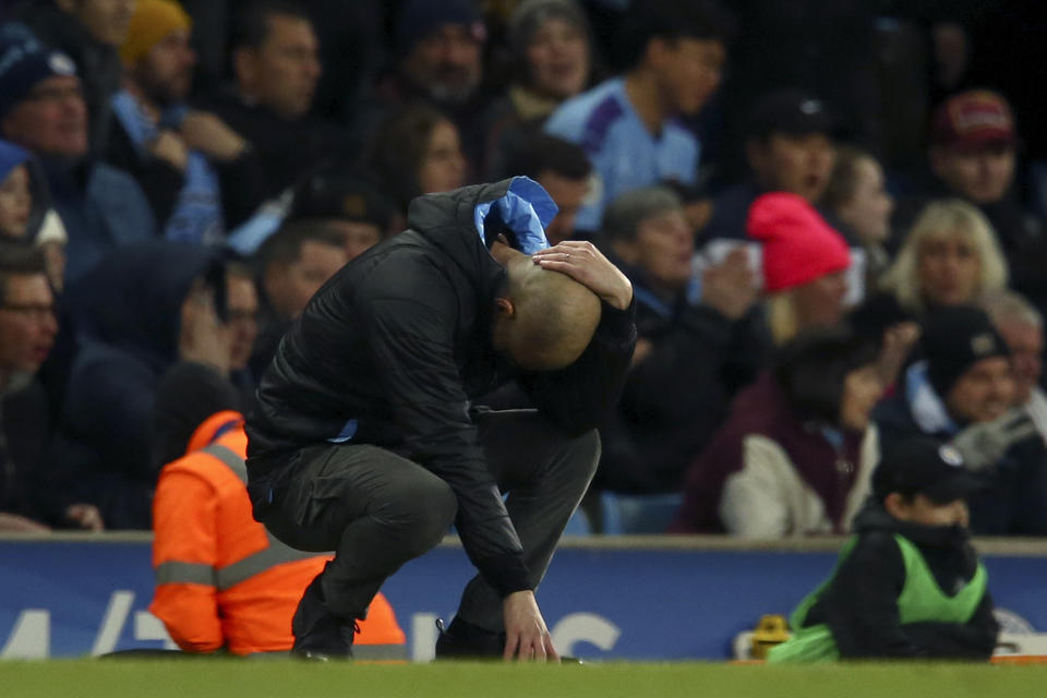 Manchester City's head coach Pep Guardiola reacts after a missed chance to score during the English League Cup semifinal second leg soccer match between Manchester City and Manchester United at Etihad stadium in Manchester, England, Wednesday, Jan. 29, 2020. (AP Photo/Dave Thompson)