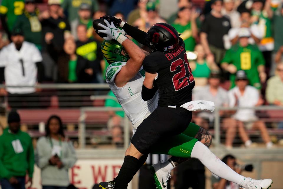 Oregon tight end Terrance Ferguson, left, catches a touchdown while defended by Stanford safety Scotty Edwards during the second half of the game Saturday Sept. 30, 2023, in Stanford, California.