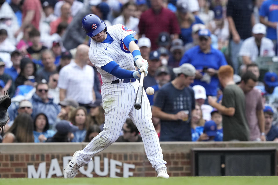 Chicago Cubs' Ian Happ hits a home run off Atlanta Braves relief pitcher A.J. Minter during the seventh inning of a baseball game Saturday, Aug. 5, 2023, in Chicago. (AP Photo/Charles Rex Arbogast)