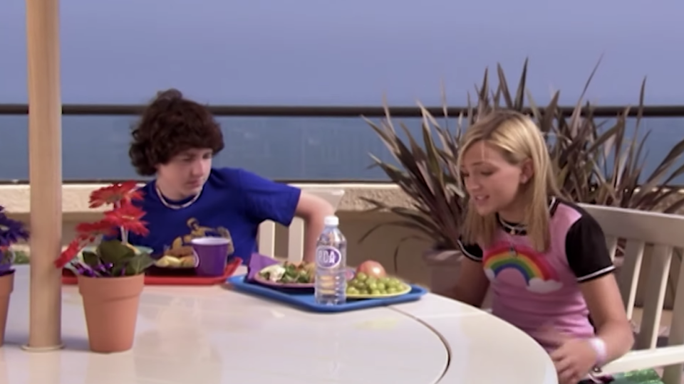 Two students at PCA eating at a waterfront cafeteria