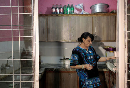 Shakeela, a member of the transgender community, works in the kitchen at home in Peshawar, Pakistan January 23, 2017. REUTERS/Caren Firouz