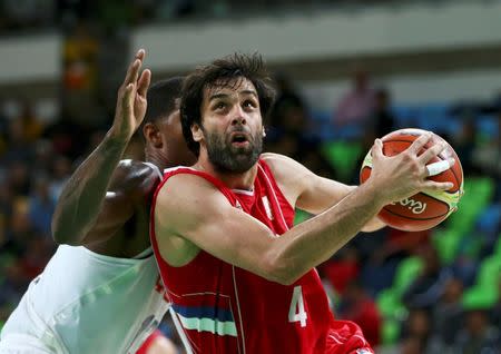 Milos Teodosic of Serbia drives to the basket. REUTERS/Marko Djurica