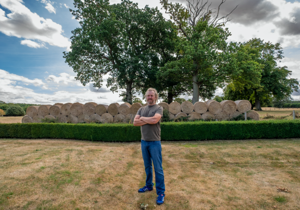 John Turner says the giant wall of hay blocks the view of the meadow. (SWNS)