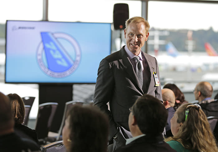 Pat Shanahan, senior vice president of Airplane Programs for Boeing Commercial Airplanes, greets guests at a re-opening ceremony for Boeing's newly expanded 737 delivery center, Monday, Oct. 19, 2015, at Boeing Field in Seattle. The center will be the main delivery point for various configurations of the 737 single-aisle airplanes to customers and is double the size of the previous building. 