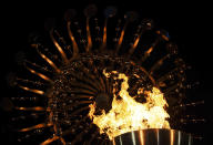 Flames burn in the Olympic cauldron after being lit during the opening ceremony of the 2016 Summer Olympics in Rio de Janeiro, Brazil, Saturday, Aug. 6, 2016. (AP Photo/Gregory Bull)