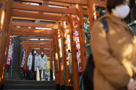 Worshippers visit shrines situated side by side in Tokyo on New Year's Day, Friday, Jan. 1, 2021. (AP Photo/Hiro Komae)