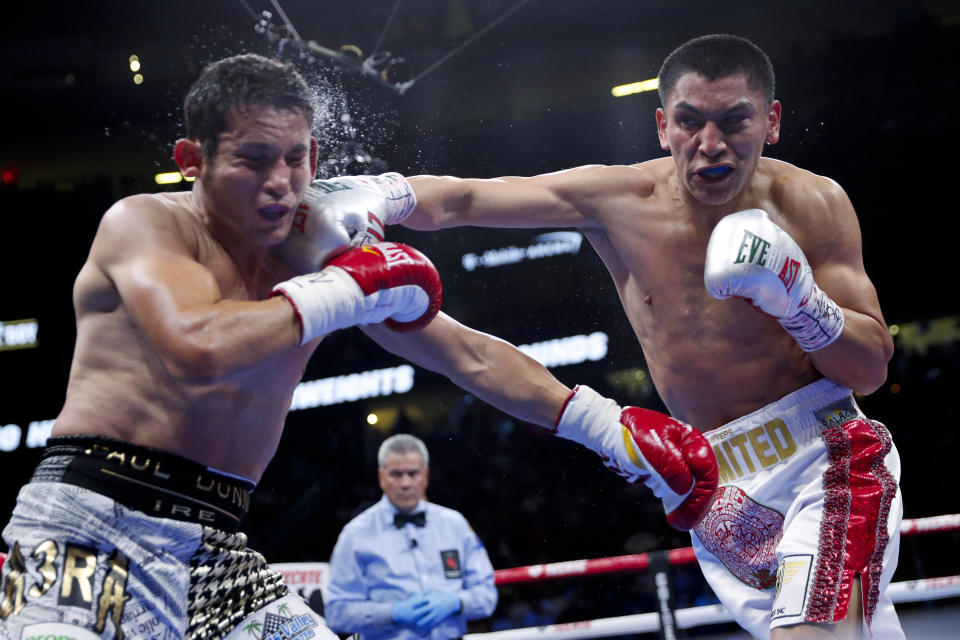 Vergil Ortiz Jr., right, hits Mauricio Herrera during a welterweight boxing match Saturday, May 4, 2019, in Las Vegas. (AP Photo/John Locher)