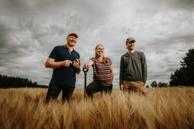 (L-R) Finnish farmers Antti Finskas (on his farm in Vuolenkoski) and Sirkku Puumala and Patrick Nyström (whose Carbon Action farm is in Vihti) supplied regenerative barley to Sinebrychoff, a Carlsberg Group company, for its annual KOFF Christmas Beer and who are actively promoting regenerative farming among Finnish barley farmers.