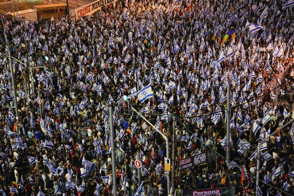 Israelis protest against plans by Prime Minister Benjamin Netanyahu's government to overhaul the judicial system in Tel Aviv, Saturday, June 3, 2023. (AP Photo/Ariel Schalit)