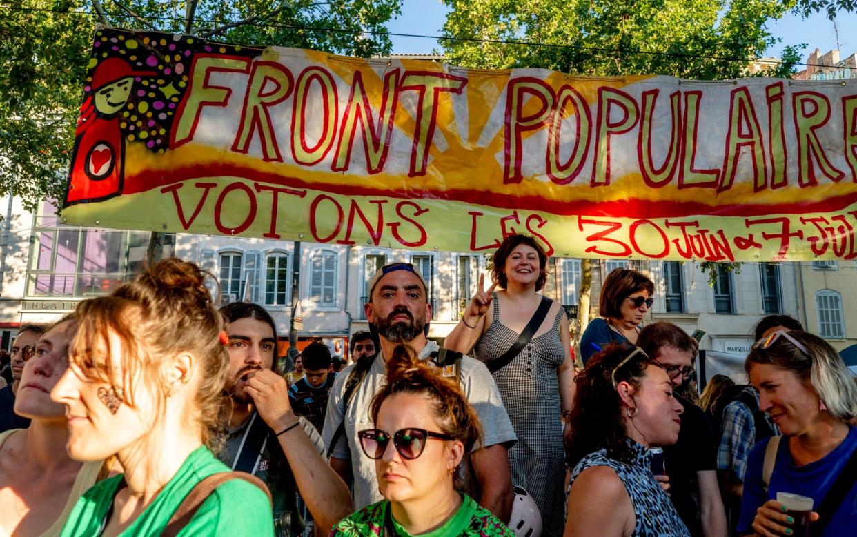 Rally-goers in support of the new Leftist alliance carried banners that said 'Popular Front. Let's vote on June 30 and July 7'