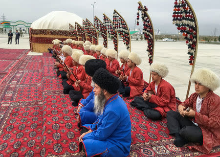 Artists performs during a parliamentary election in Ashgabat, Turkmenistan March 25, 2018. REUTERS/Marat Gurt