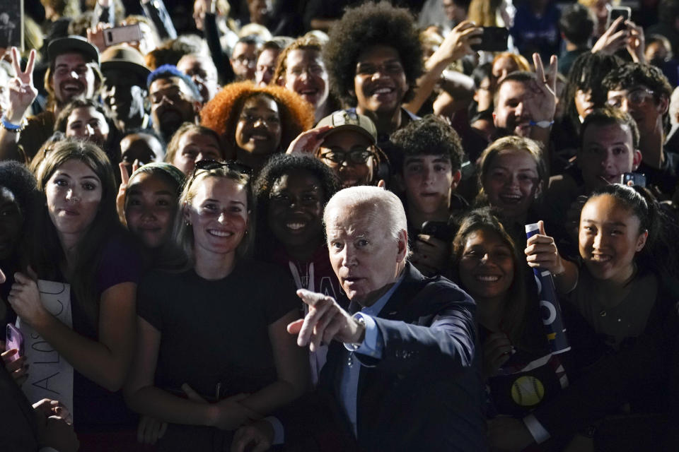 President Joe Biden points as he tells members of the crowd where to look to get a photo taken after a campaign event for New York Gov. Kathy Hochul, Sunday, Nov. 6, 2022, at Sarah Lawrence College in Yonkers, N.Y. (AP Photo/Patrick Semansky)