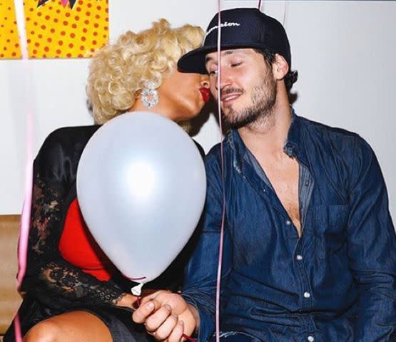 Amber Rose/Instagram Amber Rose holding a balloon next to Val Chmerkovskiy in a photo during her 33rd birthday party