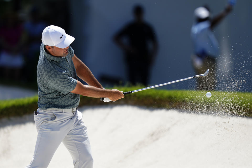 Scottie Scheffler hits from the sand on the seventh hole during the final round of the Charles Schwab Challenge golf tournament at the Colonial Country Club in Fort Worth, Texas, Sunday, May 29, 2022. (AP Photo/LM Otero)
