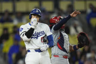 Los Angeles Dodgers' Shohei Ohtani blows into his hand after swinging at a pitch during the fifth inning of a baseball game against the St. Louis Cardinals Saturday, March 30, 2024, in Los Angeles. (AP Photo/Jae C. Hong)