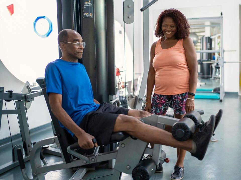 A man doing leg extensions.