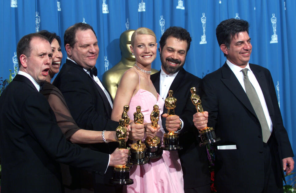 Shakespeare in Love'Best Actress winner Gwyneth Paltrow (centre) is joined by Harvey Weinstein (centre left) David Parfitt (left), Donna Gigliotti, Edward Zwick and Marc Norman (right) backstage as they celebrated their win of Best Picture at the 1999 Academy Awards..(Photo by Bob Riha, Jr./Getty Images)