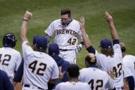 Milwaukee Brewers' Eric Sogard celebrates after hitting a walk off two-run home run during the ninth inning of a baseball game against the Pittsburgh Pirates Saturday, Aug. 29, 2020, in Milwaukee. The Brewers won 7-6. (AP Photo/Morry Gash)