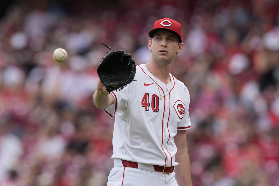 Cincinnati Reds starting pitcher Nick Lodolo catches a ball between batters in the first inning of a baseball game against the Baltimore Orioles, Sunday, May 5, 2024, in Cincinnati. (AP Photo/Carolyn Kaster)