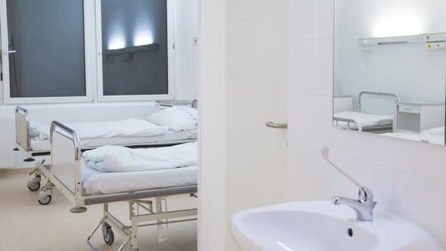 A hospital room and restroom