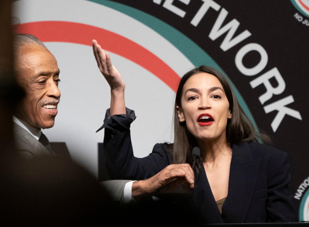 Representative Alexandria Ocasio-Cortez is welcomed by the Reverend Al Sharpton during a gathering of the National Action Network on April 5, 2019 in New York. (Photo credit should read DON EMMERT/AFP/Getty Images)