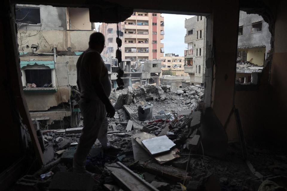 PHOTO: A Palestinian man inspects the damage a day after an operation by the Israeli Special Forces in the Nuseirat camp, in the central Gaza Strip on June 9, 2024. (Eyad Baba/AFP via Getty Images)