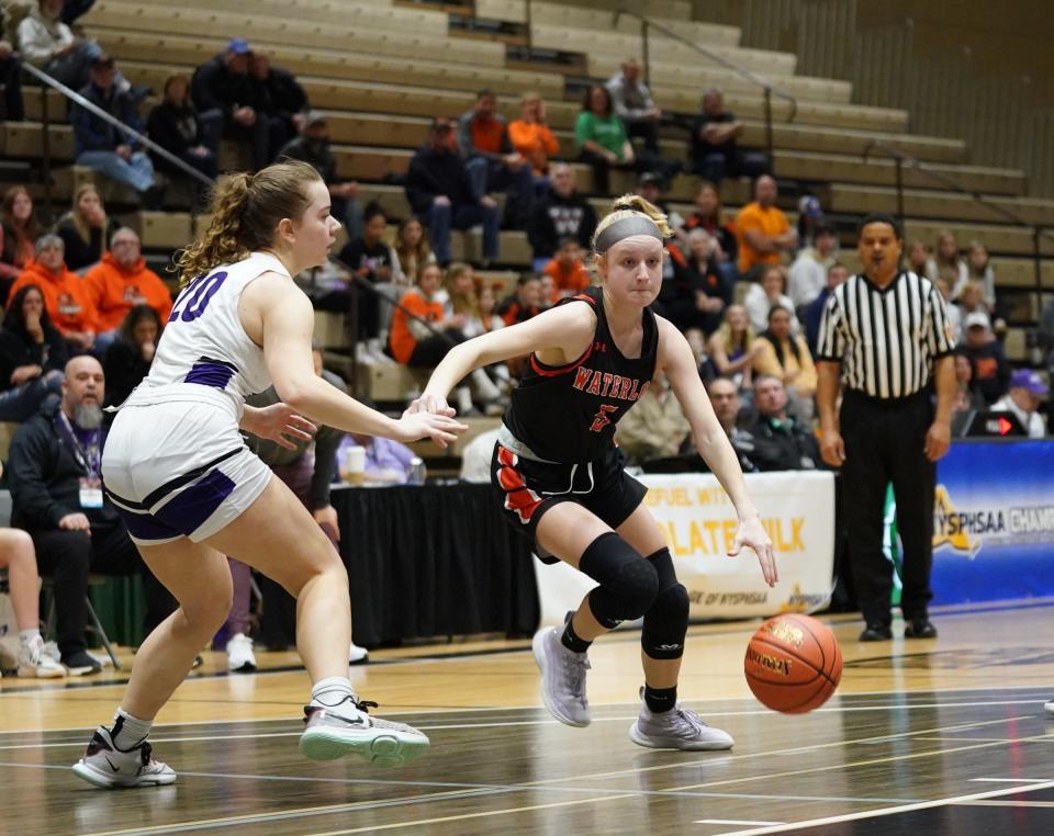 Waterloo's Addison Bree (5) drives to the paint in the girls Class B state semifinal game against Cortland at Hudson Valley Community College in Troy, on Friday, March 17, 2023.